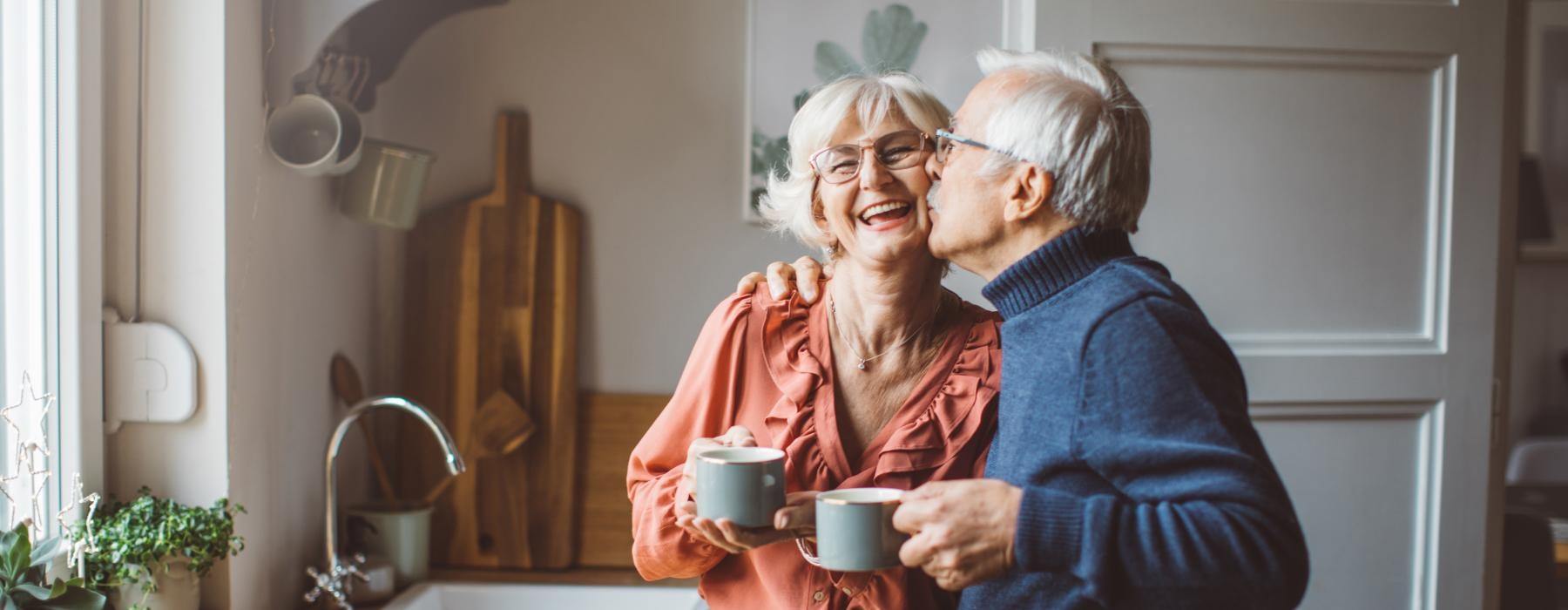 a man and woman holding a cup