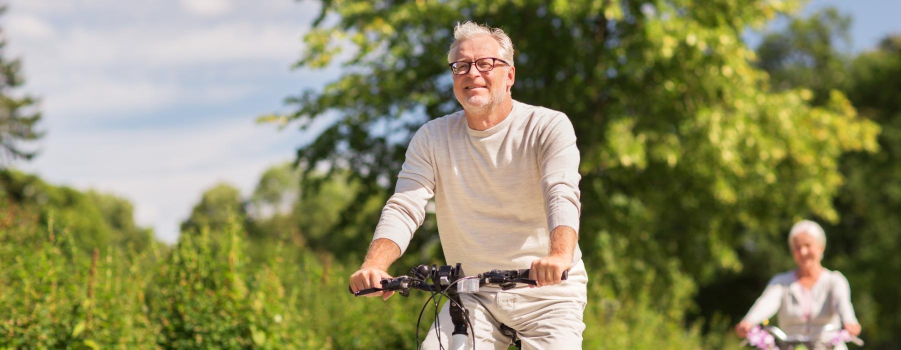 a man and woman riding bikes