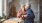 a man and woman holding a cup