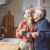 a man and woman holding a cup