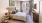 a bedroom with lots of natural light